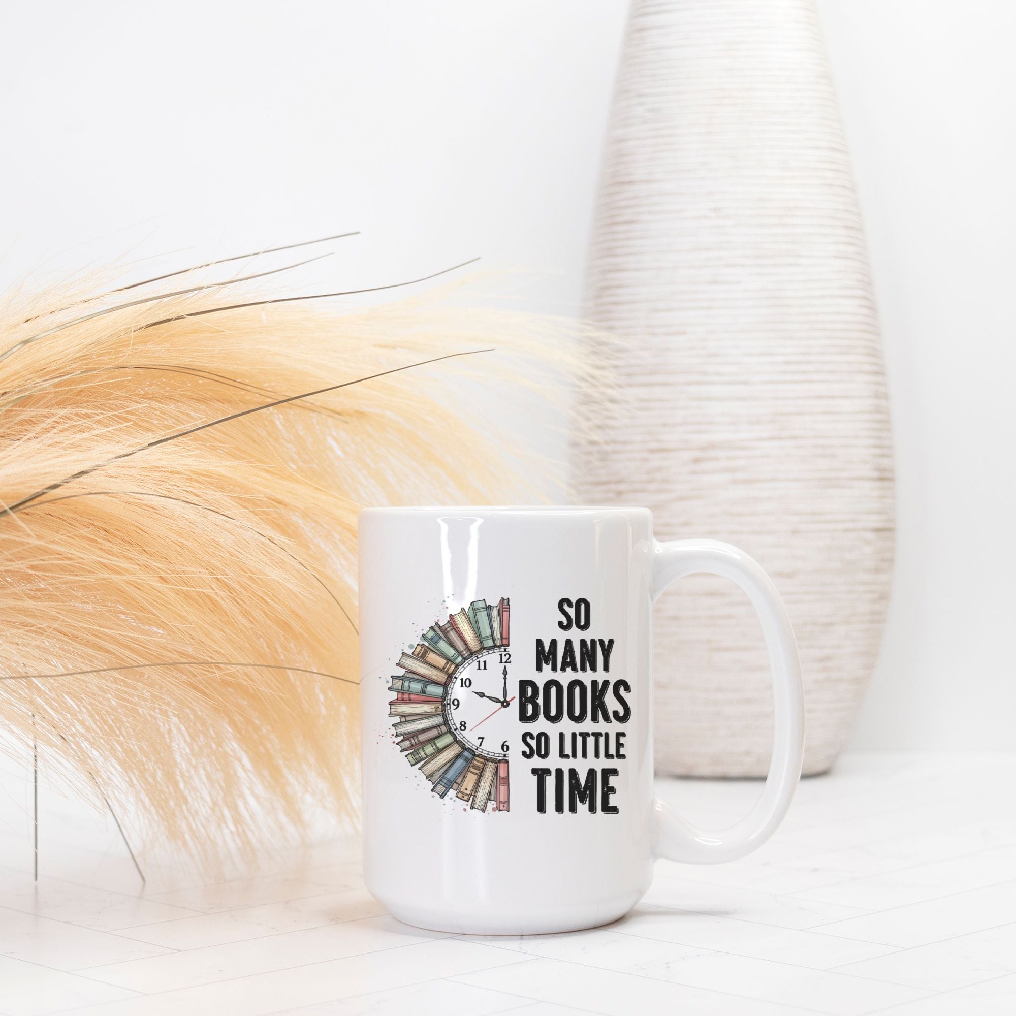 White mug with book-themed design and text on a light background