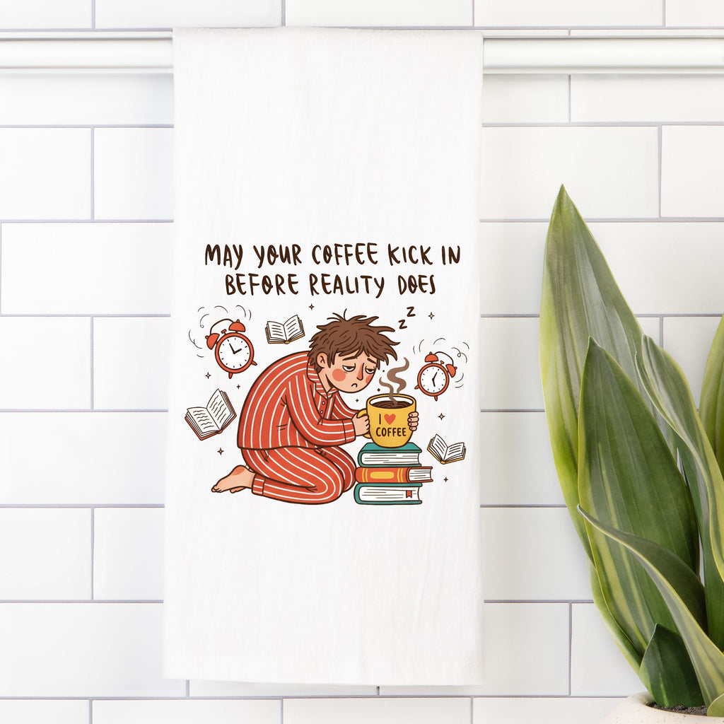 Tea towel with an Illustration of a person in pajamas holding a coffee cup with text on a white tiled wall.
