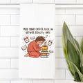 Tea towel with an Illustration of a person in pajamas holding a coffee cup with text on a white tiled wall.