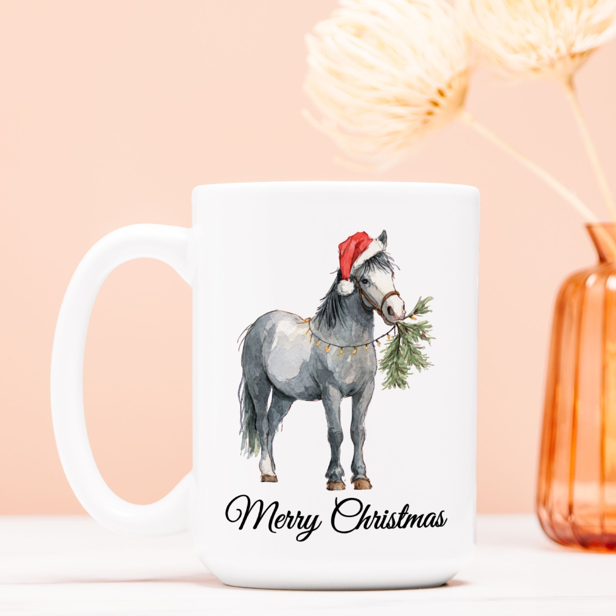 White mug with a horse wearing a Santa hat and the text 'Merry Christmas' on a light pink background.