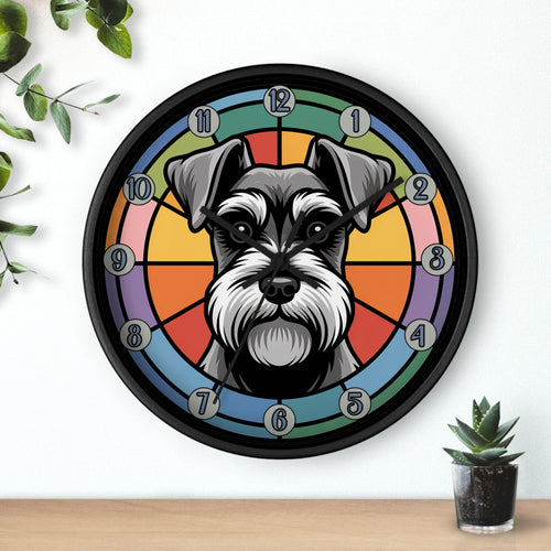 Wall clock with a schnauzer dog's face design on a colorful background, placed on a wall with a plant and small pot.
