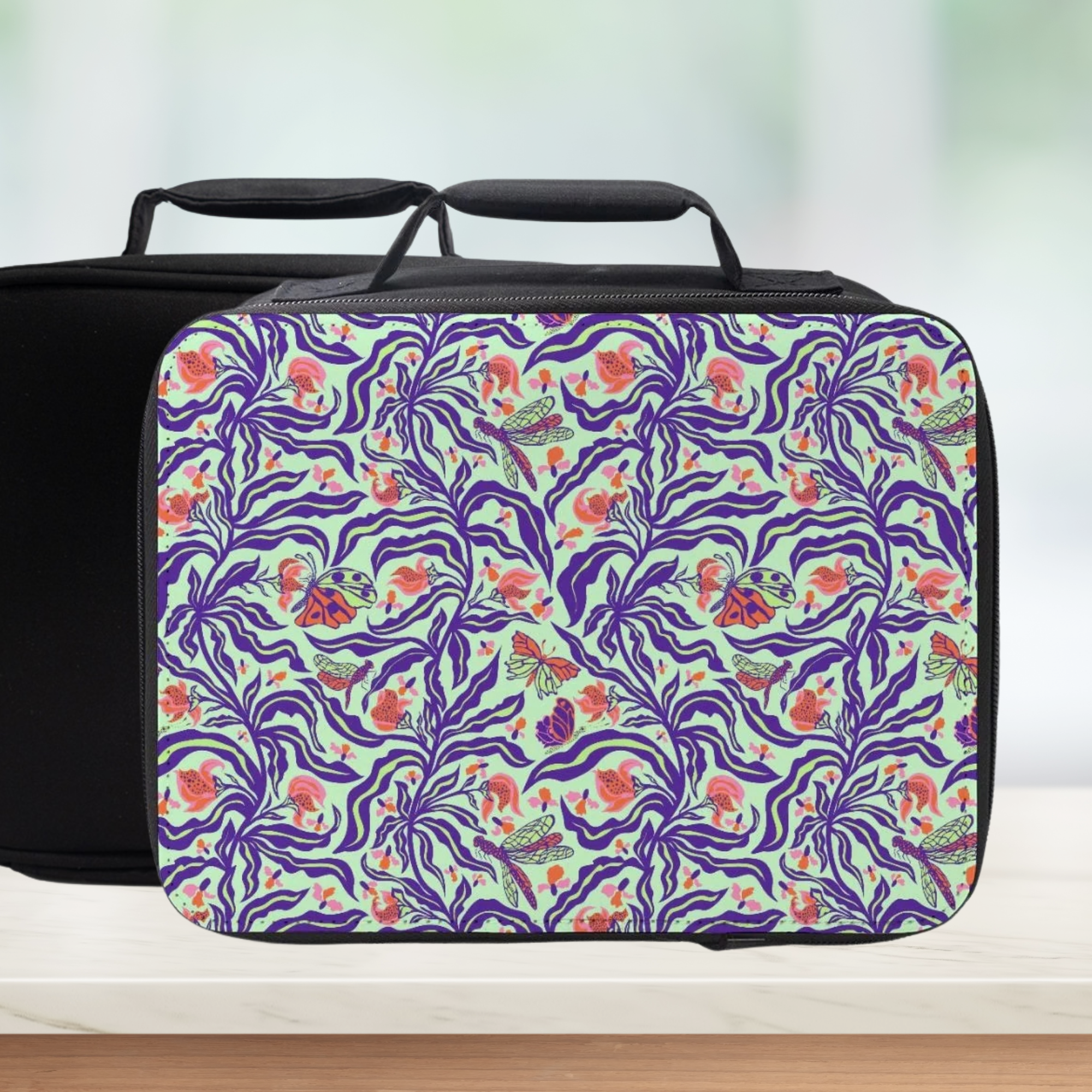 Floral and abstract patterned lunchbag on a white background