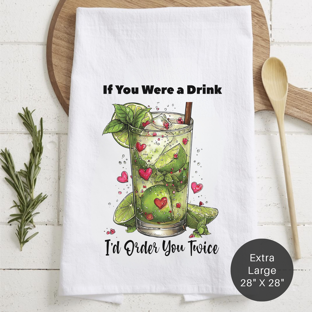 Tea towel with a cocktail graphic and text on a wooden board.
