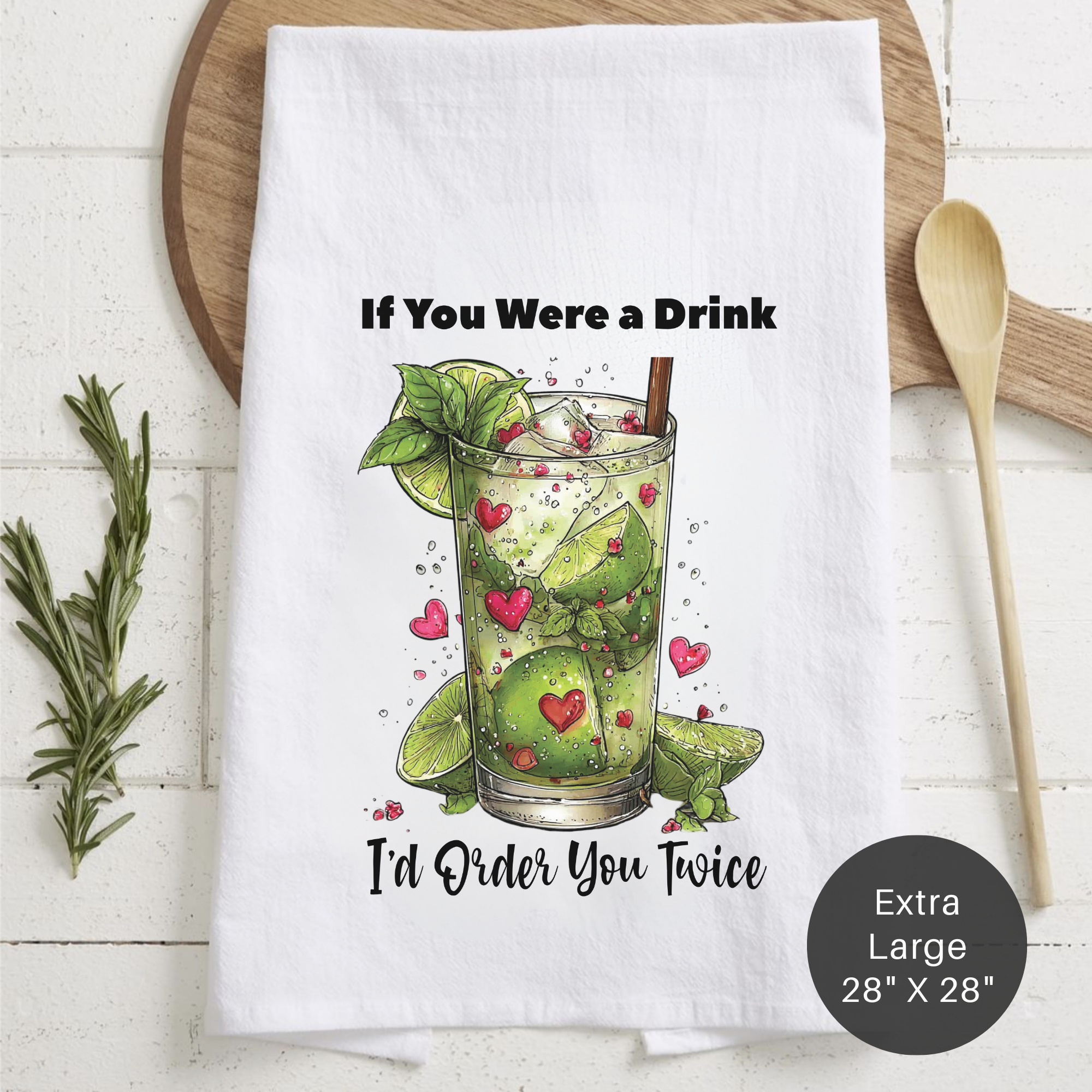 Tea towel with a cocktail graphic and text on a wooden board.
