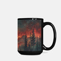 Black mug with a scenic design of trees and mountains under a starry sky.