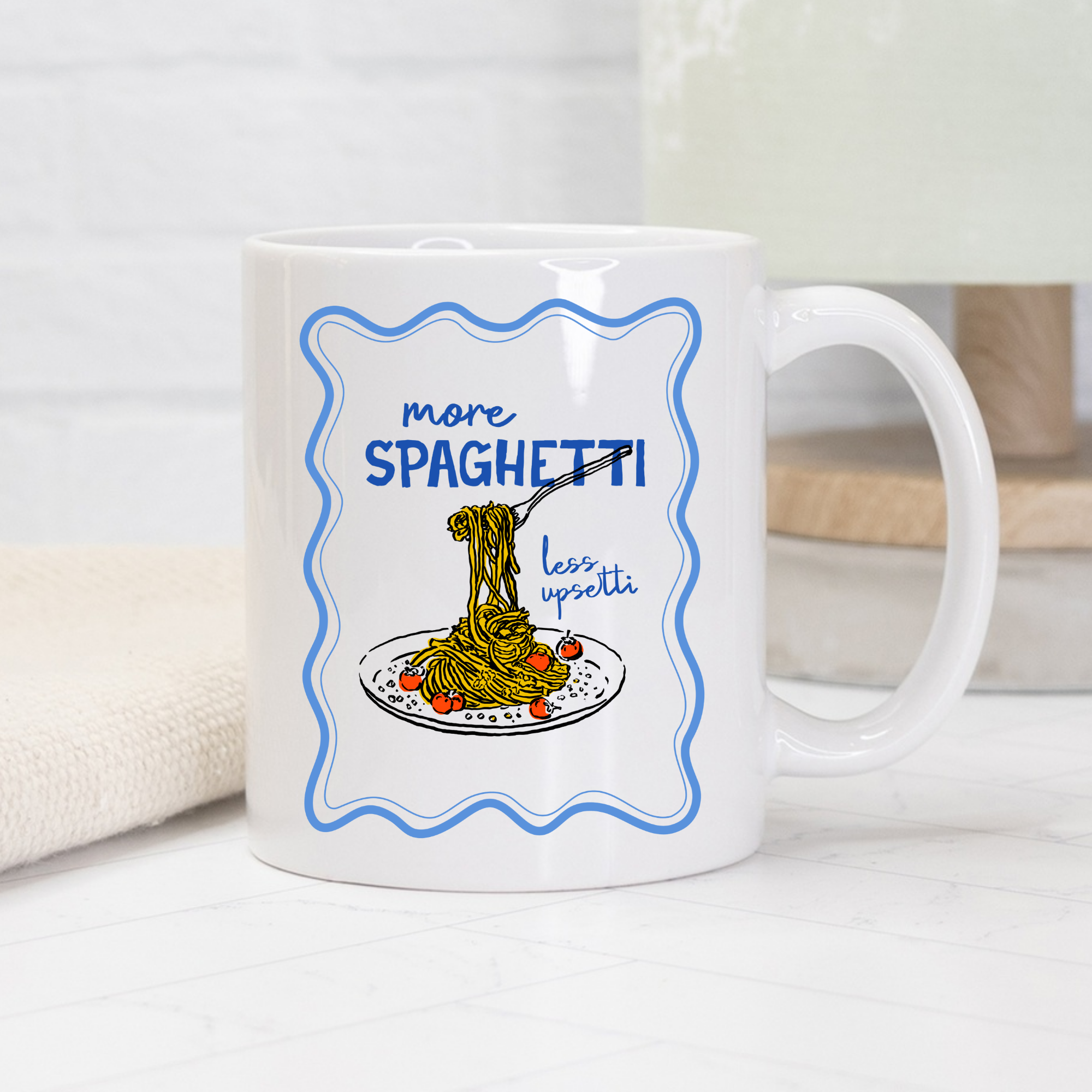 White 11oz. mug with spaghetti-themed design and text on a light background
