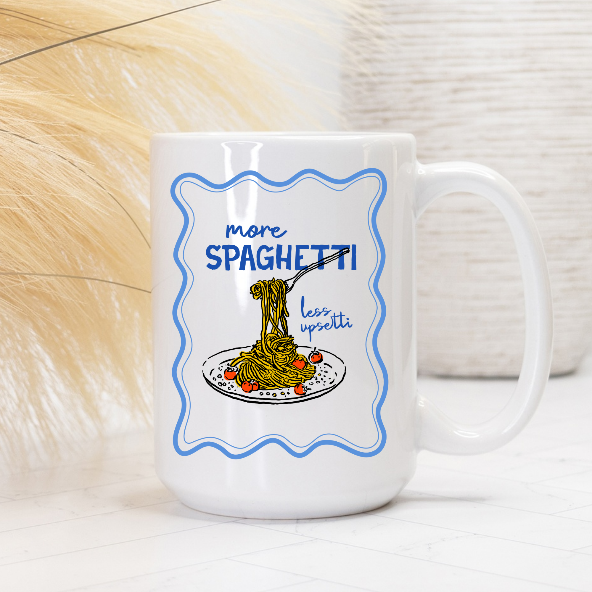 White 15oz. mug with spaghetti graphic and text 'more SPAGHETTI! less uppetti' on a light background