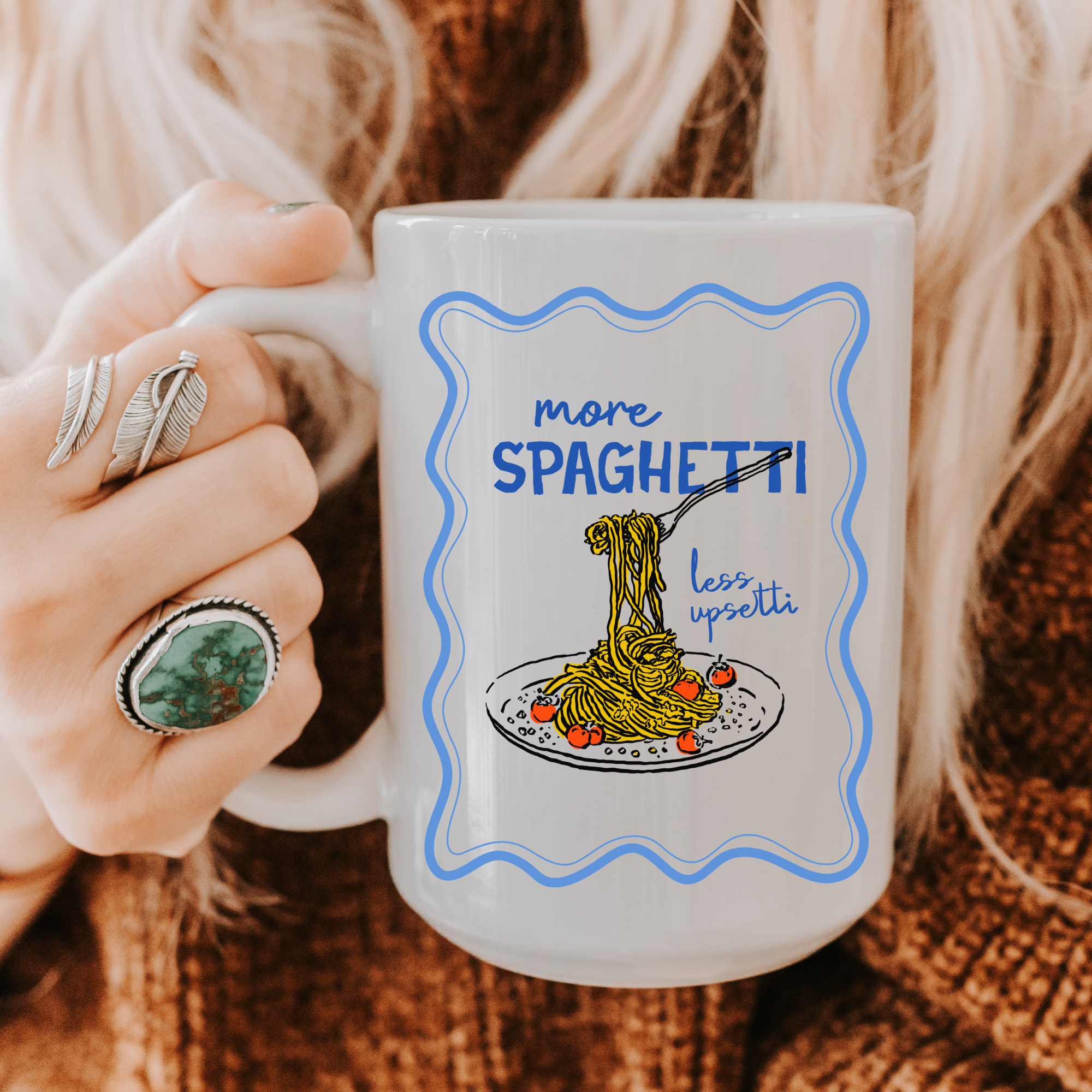 Person holding a 15oz. mug with a spaghetti-themed design and text.