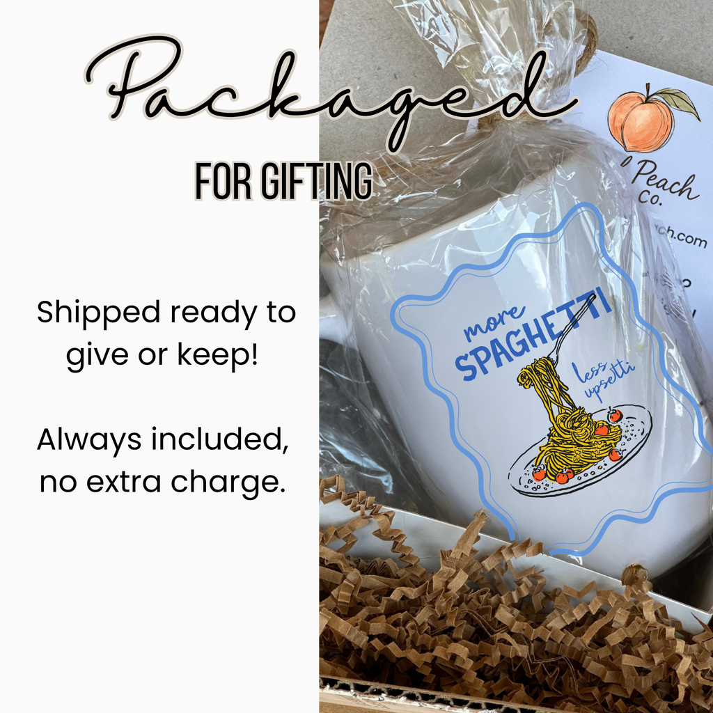 White 15oz. mug with spaghetti design and text, wrapped in clear plastic with brown paper inside a white gift box, labeled Package for Gifting.