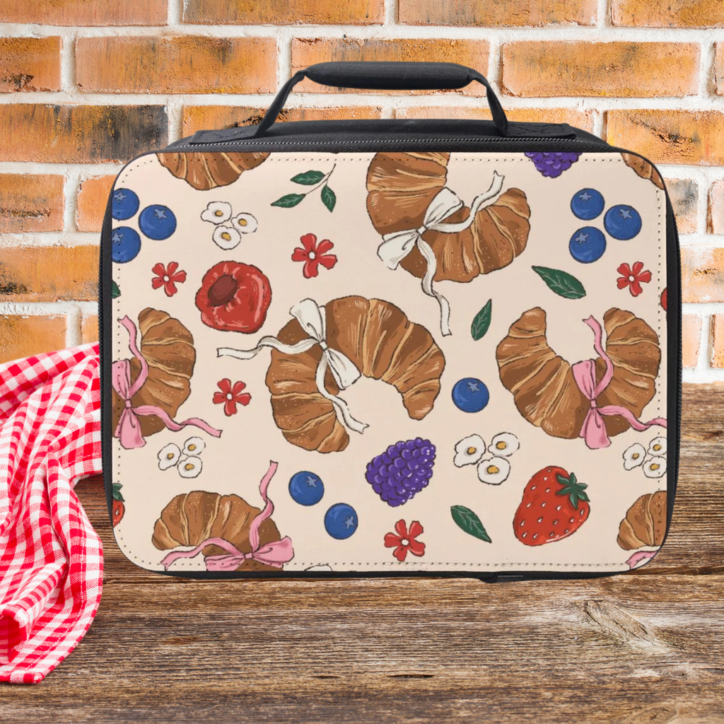 Lunch bag with colorful pattern on a wooden surface and brick wall background