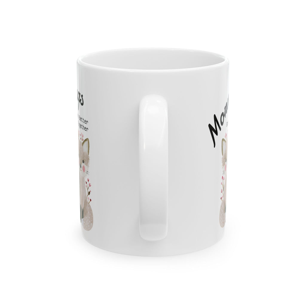 Handle view of an 11oz ceramic mug with a fox couple design on a white background.