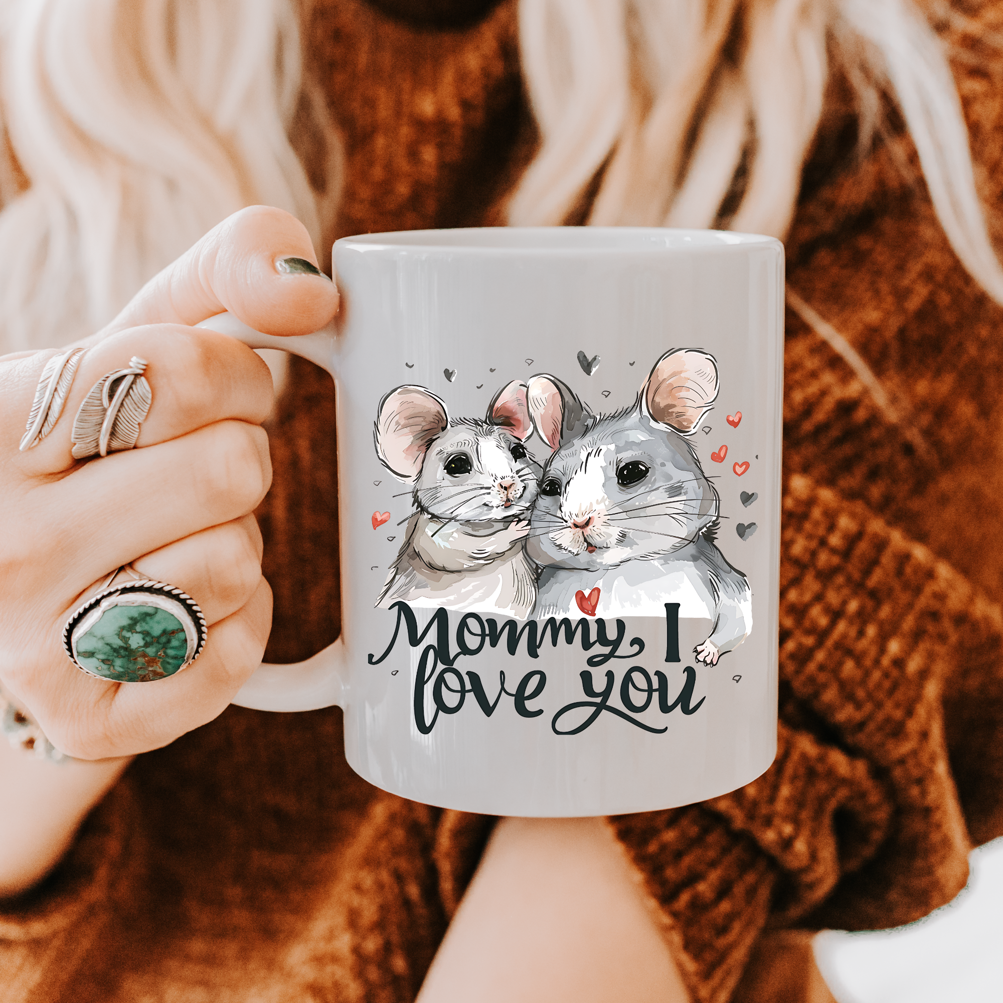 Person holding a mug with two illustrated mice and 'Mommy, I love you' text.