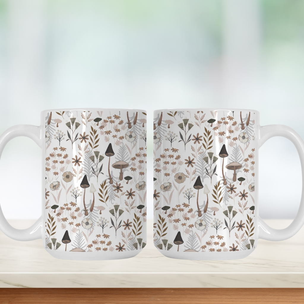 Two mugs with a nature-themed design featuring mushrooms and plants on a white background.