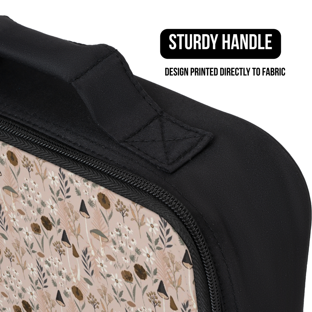 Close-up of a bag with a floral pattern and black handle, featuring text about the handle design.