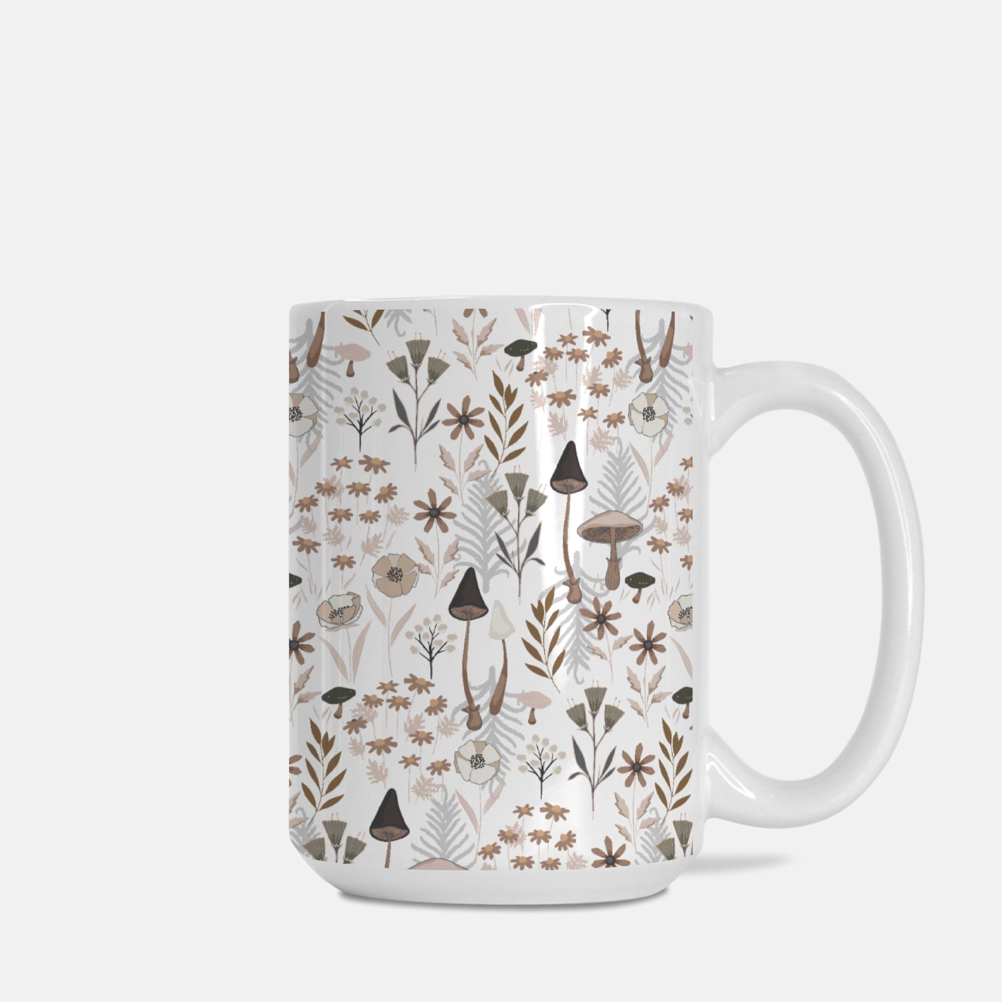 White mug with a nature-themed pattern featuring plants and mushrooms on a white background