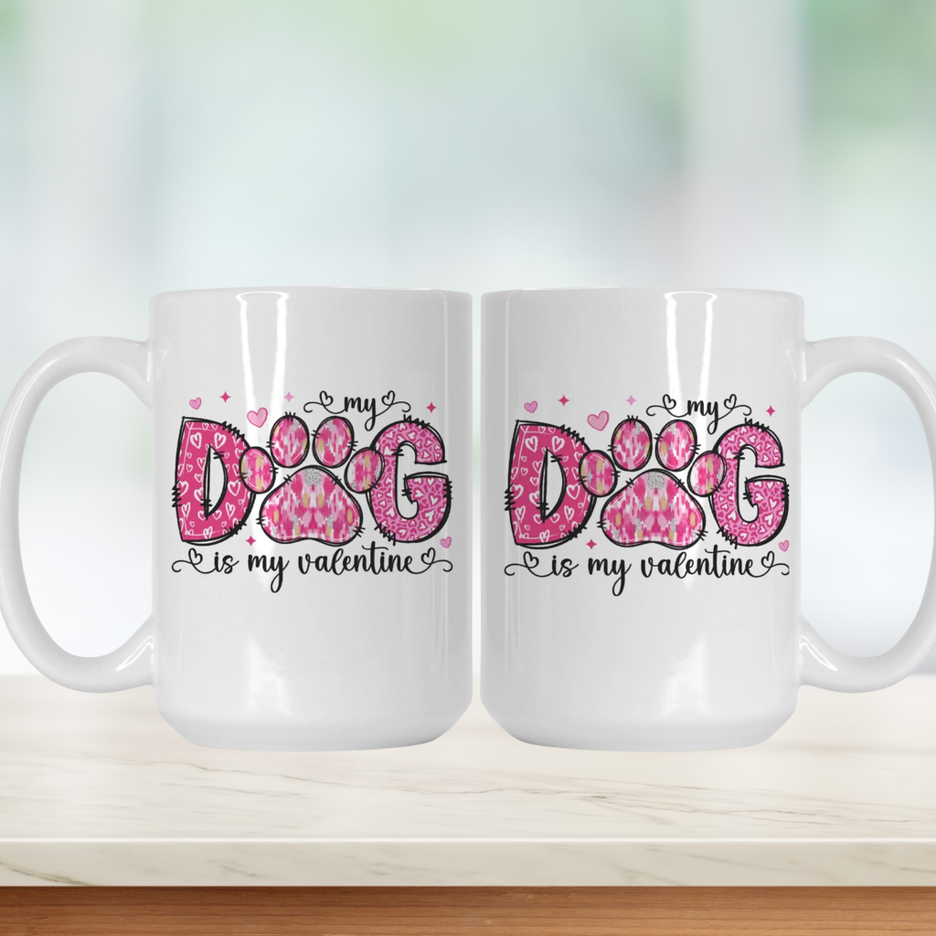 Two white mugs with pink paw print design and text on a light background
