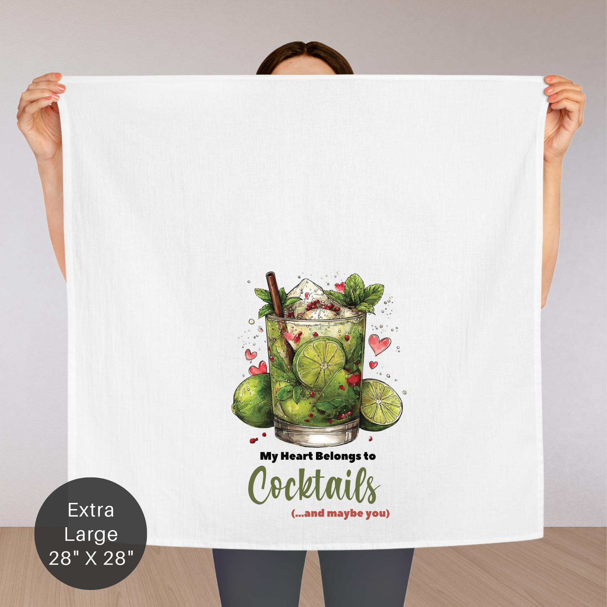 Person holding an extra large tea towel with a cocktail design and text.