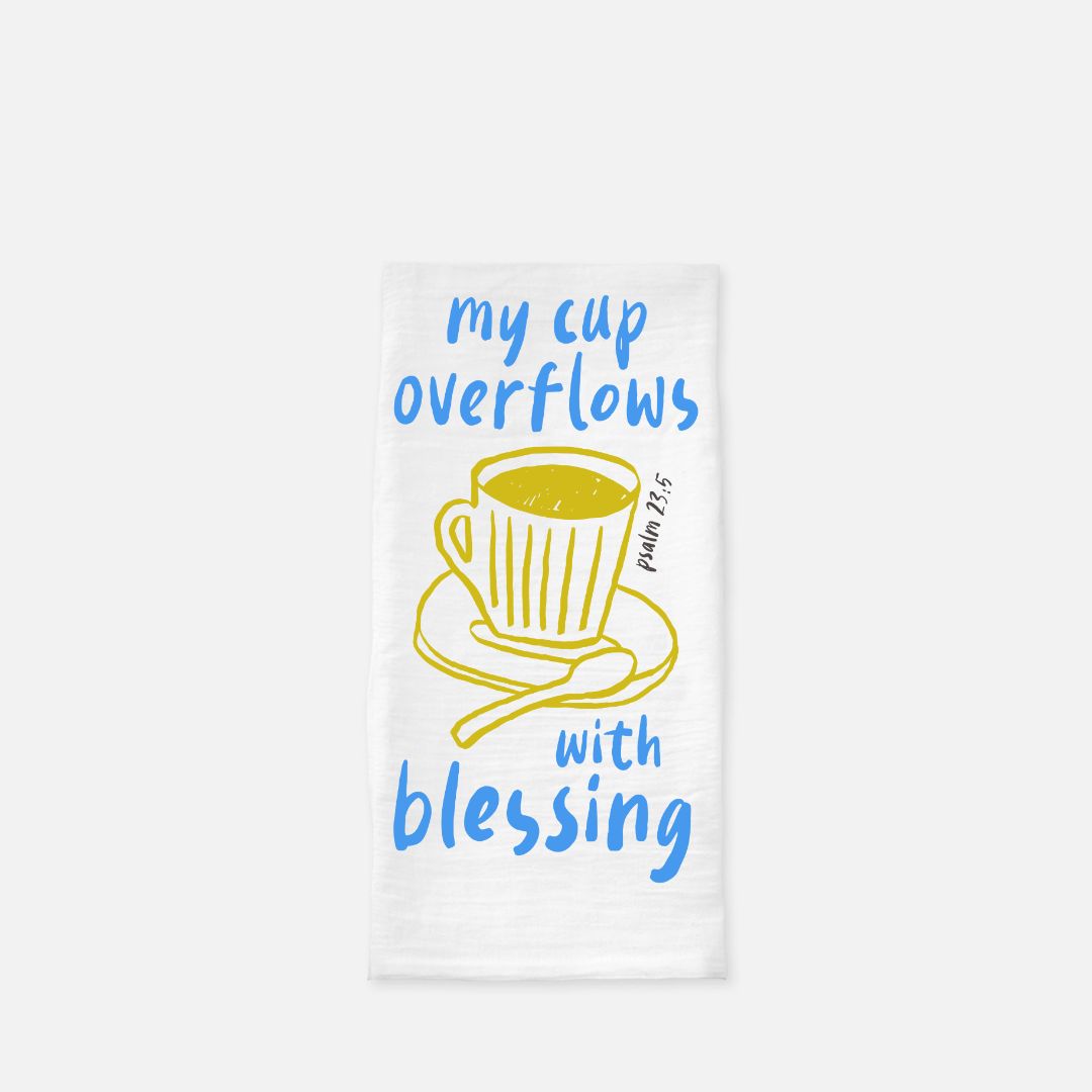Towel with a yellow cup and spoon illustration and text on a white background
