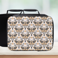 Black suitcase with butterfly pattern on a light background
