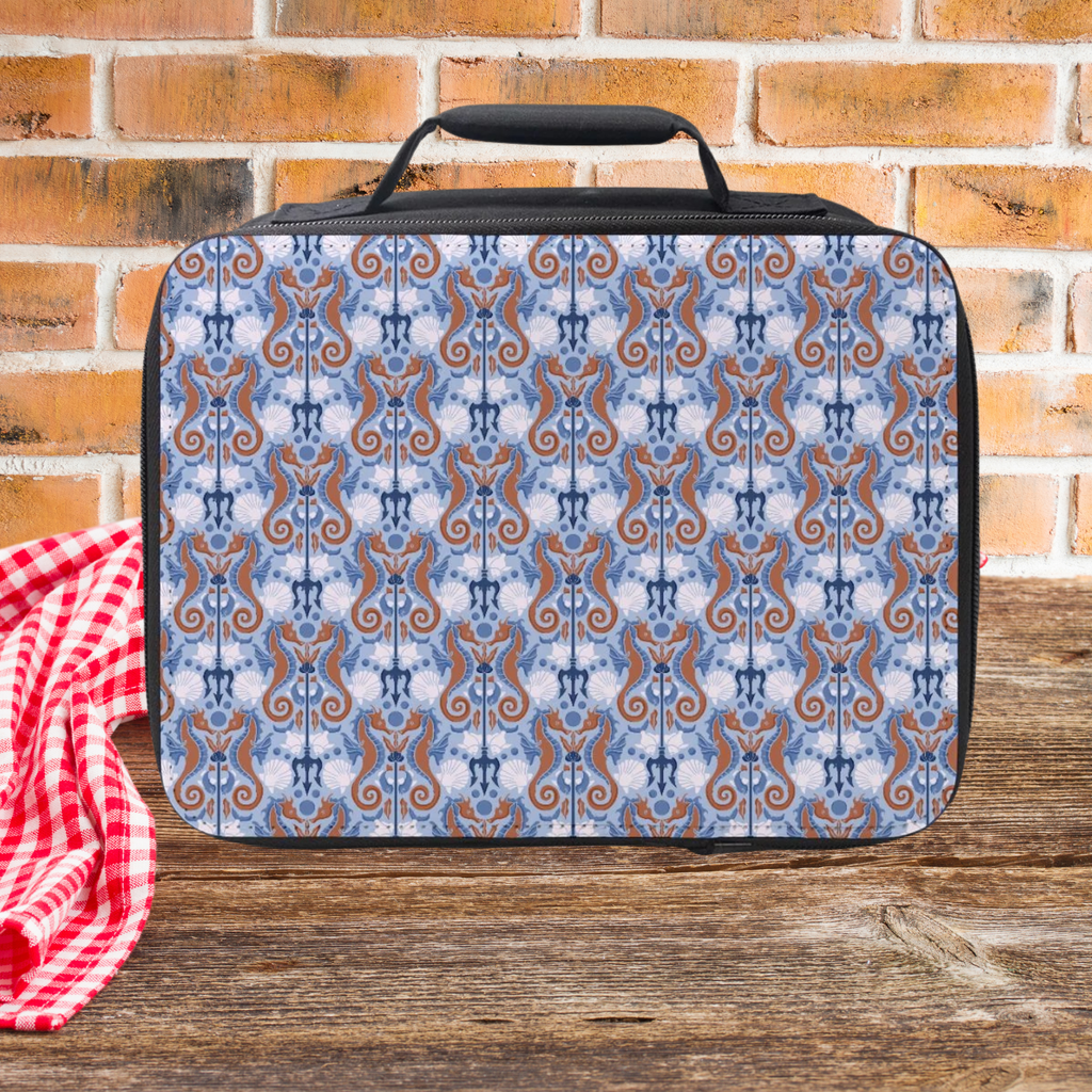 Seahorse patterned lunch bag on a wooden surface with a brick wall background