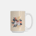 Mug with floral design and polka dot pattern on a beige background