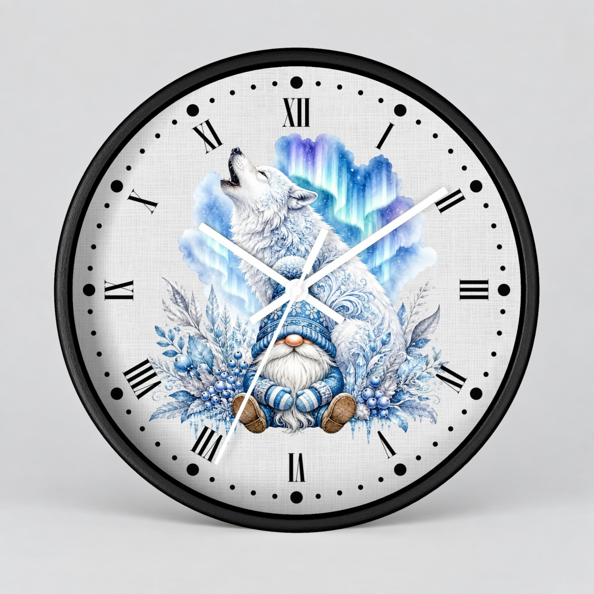 A round wall clock with a black frame and a white face featuring a whimsical illustration of a white wolf howling above a blue-and-white gnome surrounded by winter foliage and aurora-like blue light effects. The clock uses black Roman numerals and has white hands on a light gray studio background.