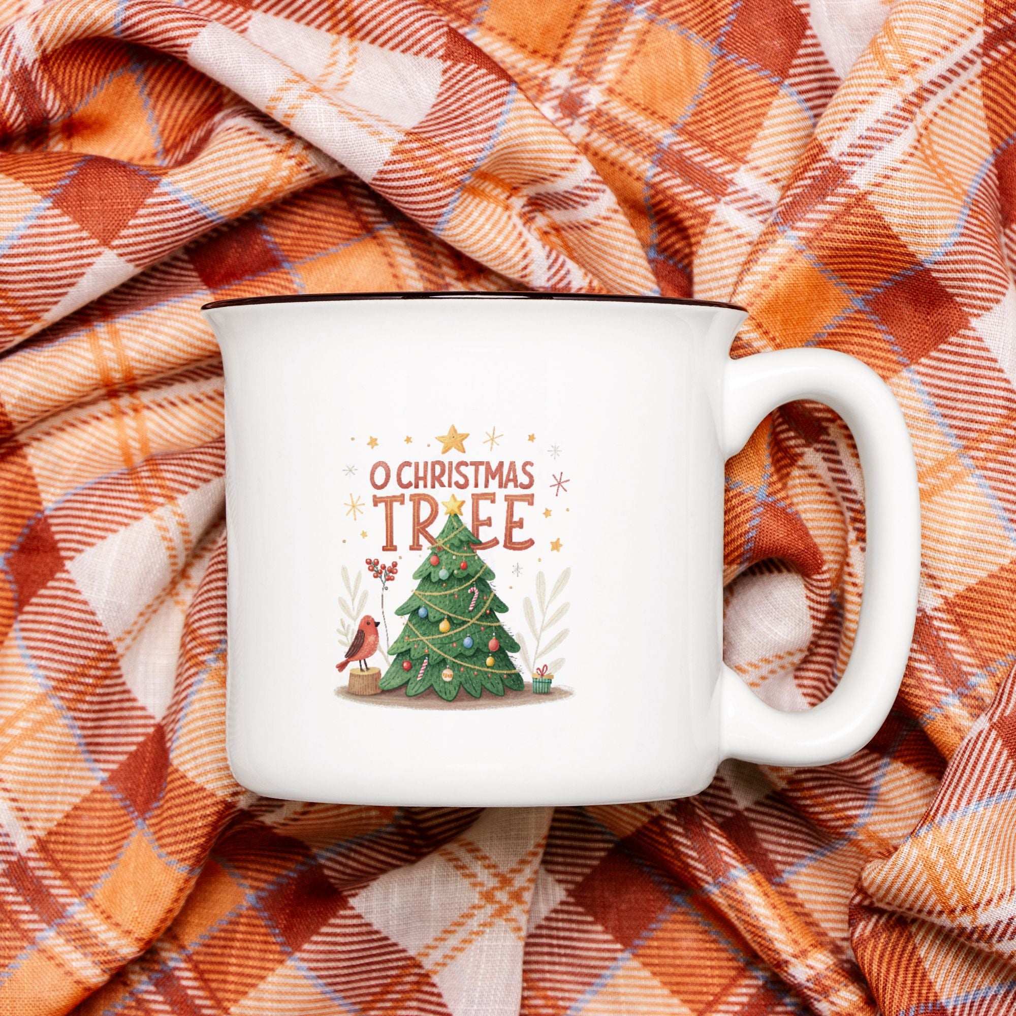 White mug with 'O Christmas Tree' design on plaid fabric