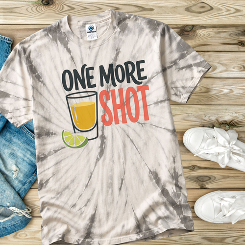 Tie-dye t-shirt  in the color Spider Silver with 'One More Shot' graphic on a wooden surface