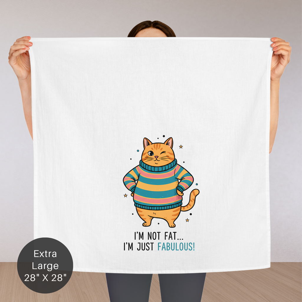 Person holding an extra large tea towel with a cat illustration and text.