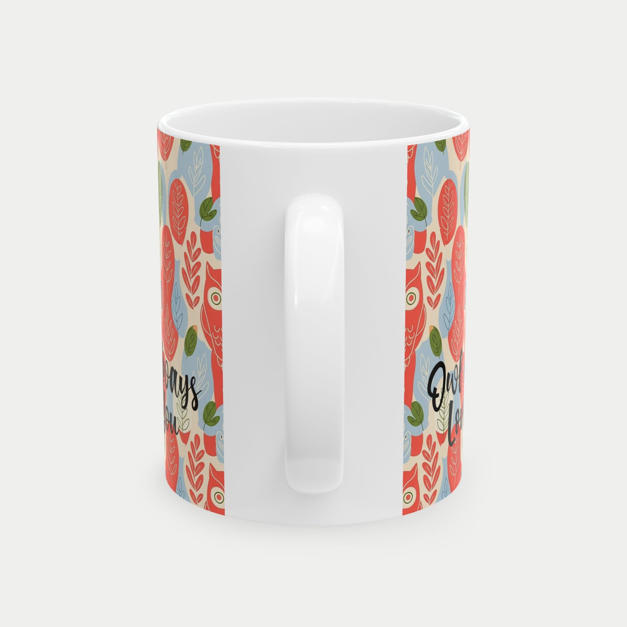 White mug with colorful patterned handles on a white background