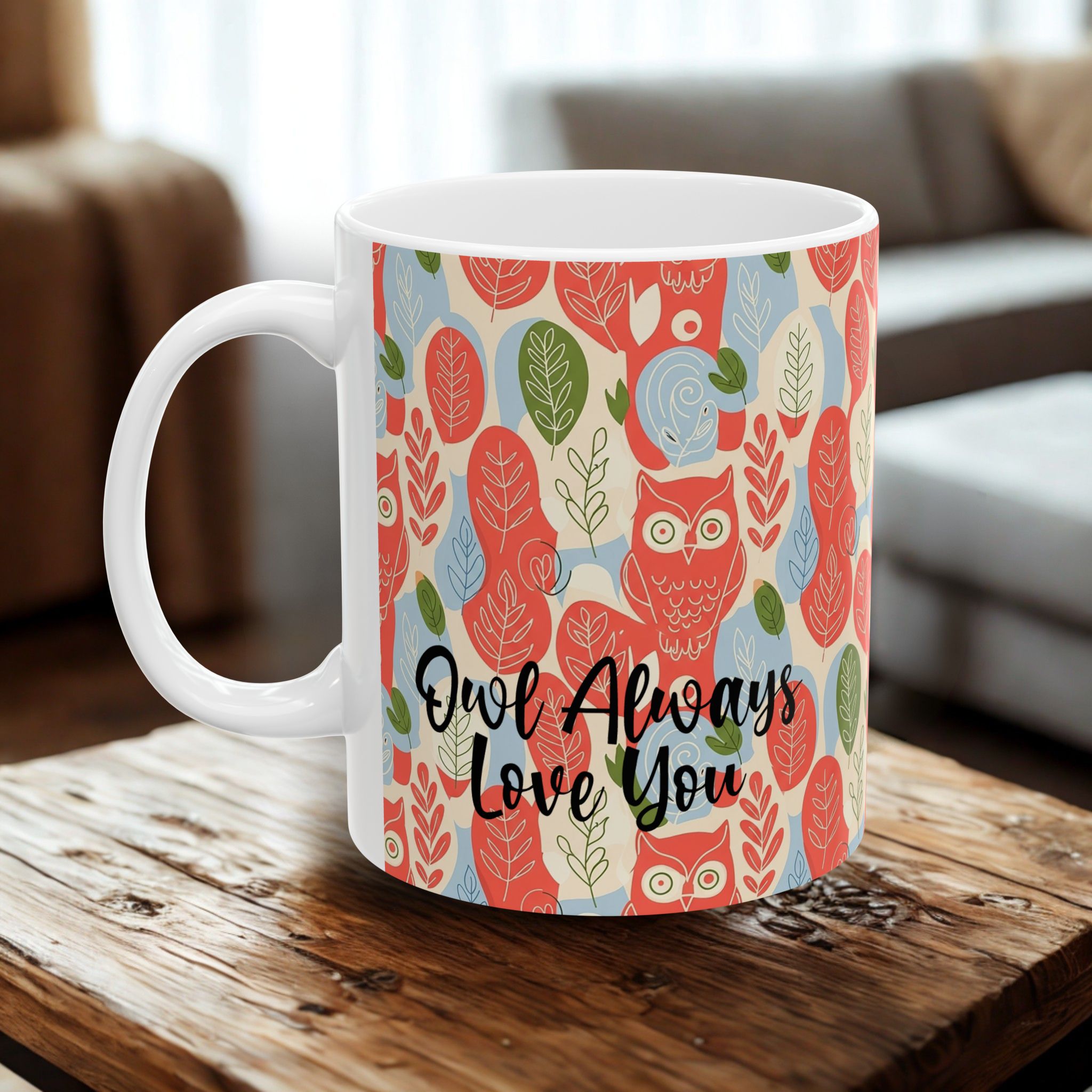 White mug with owl pattern and 'Owl Always Love You' text on a wooden table.