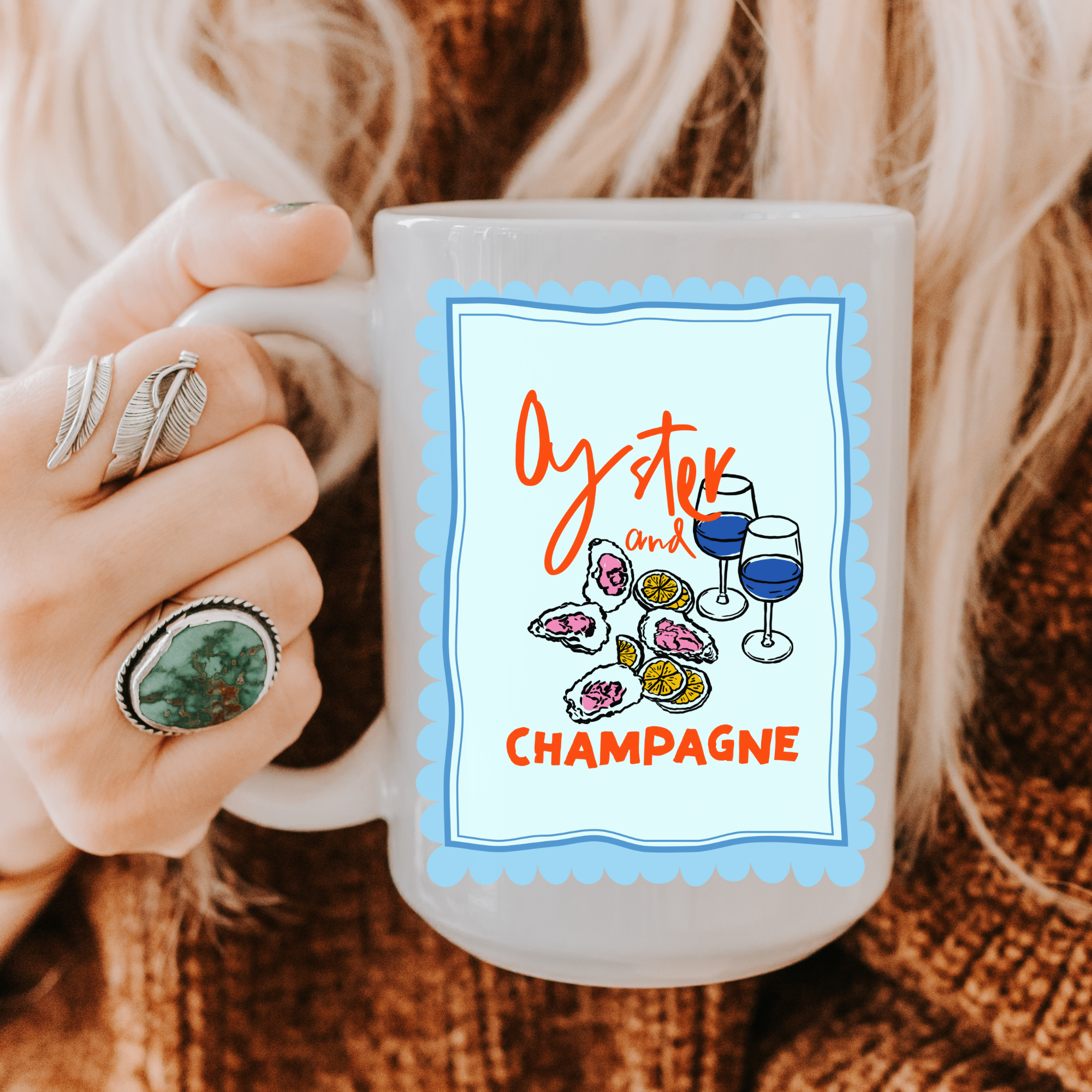 Person holding a 15oz. mug with 'Oyster and Champagne' design