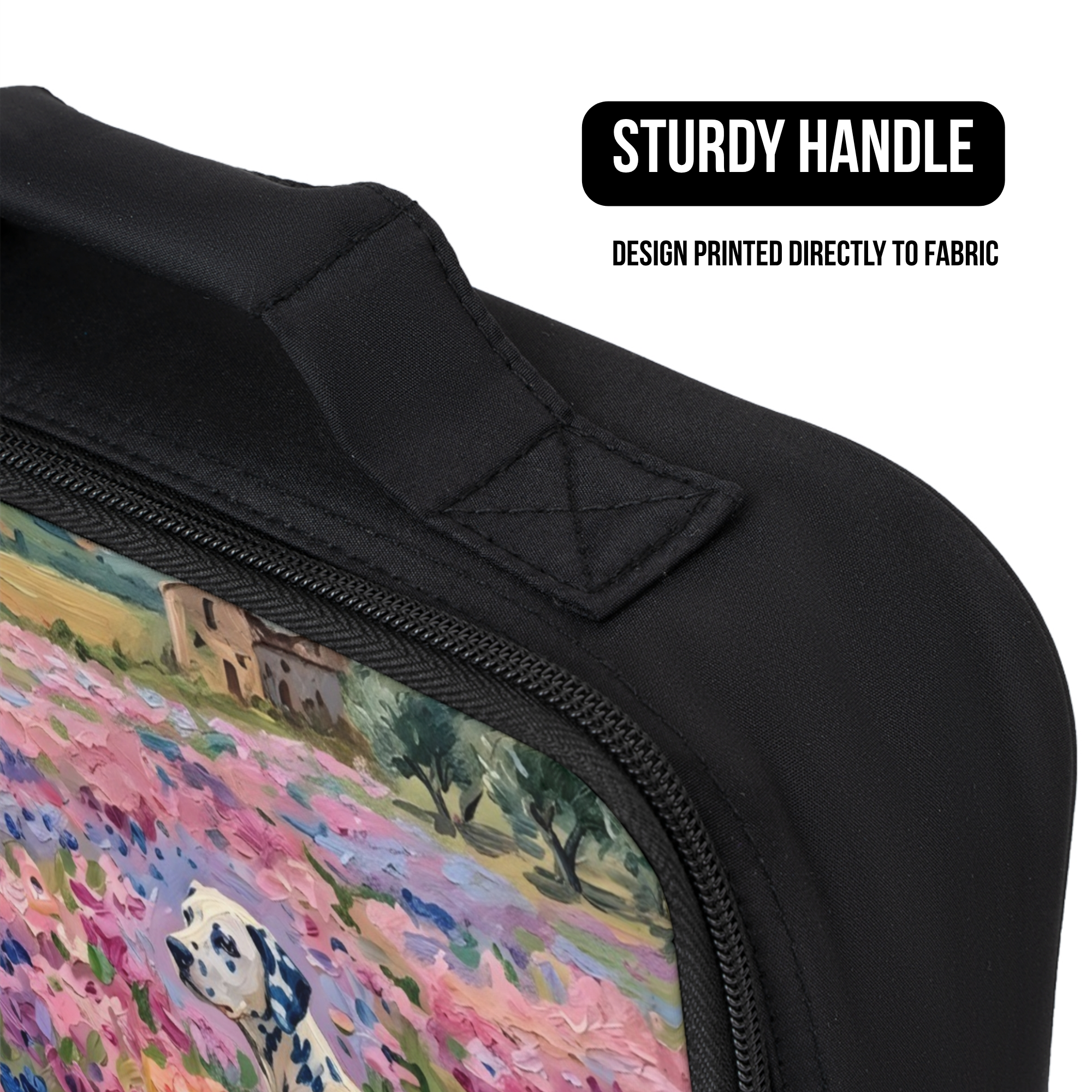 Black lunch bag close up with a colorful design of a Dalmatian dog in a field, featuring a sturdy handle.