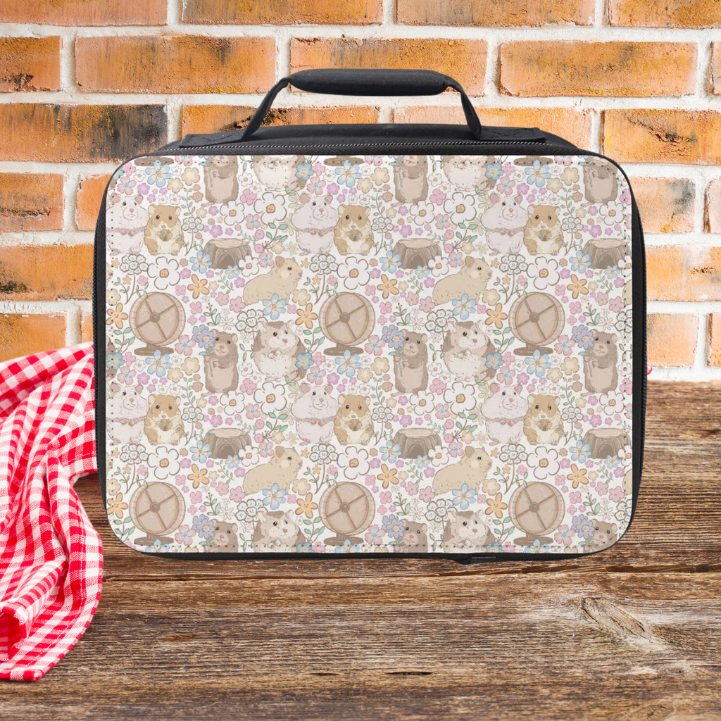 Lunch bag with hand drawn floral hamster pattern on a wooden picnic table and brick wall background