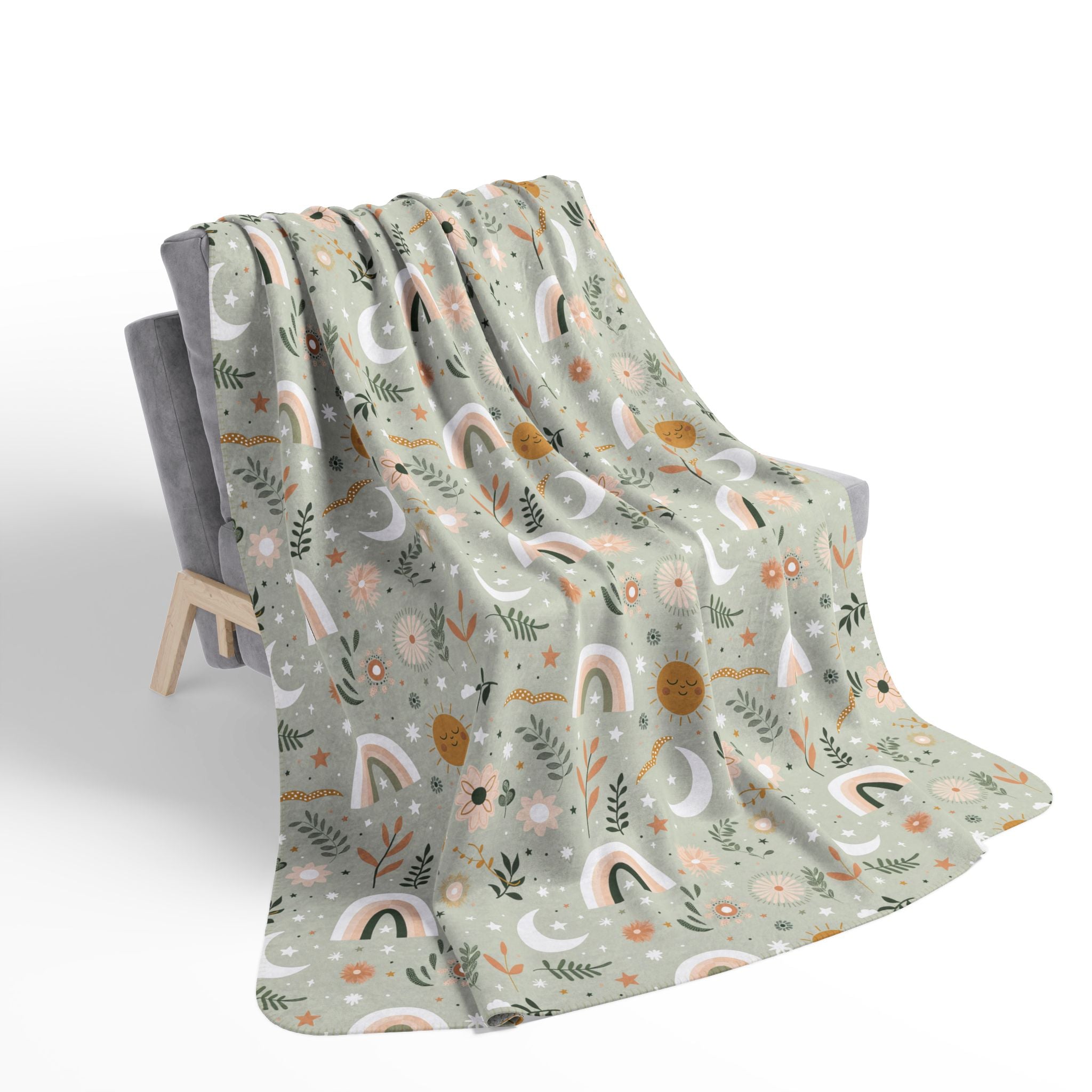 Floral patterned blanket draped over a chair on a white background