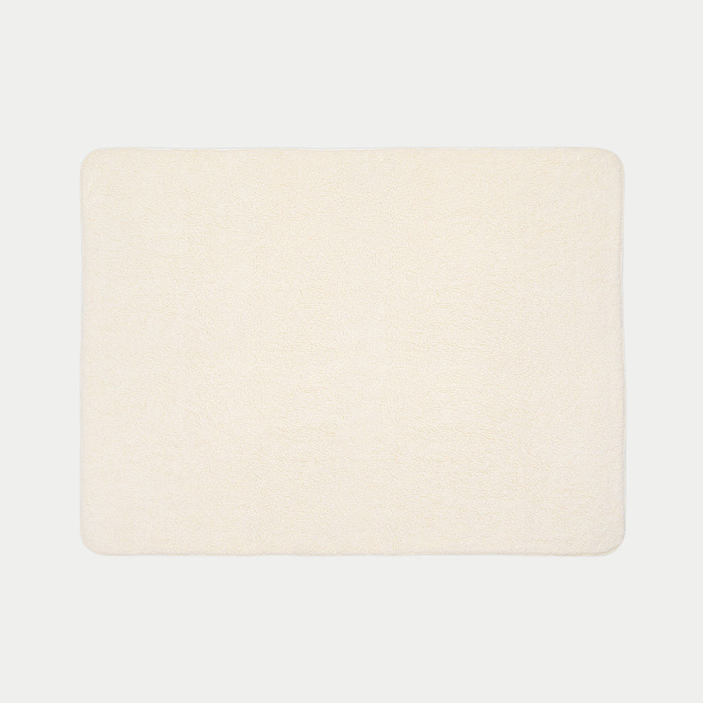 backside of Rectangular blanket with two-tone design on a white background