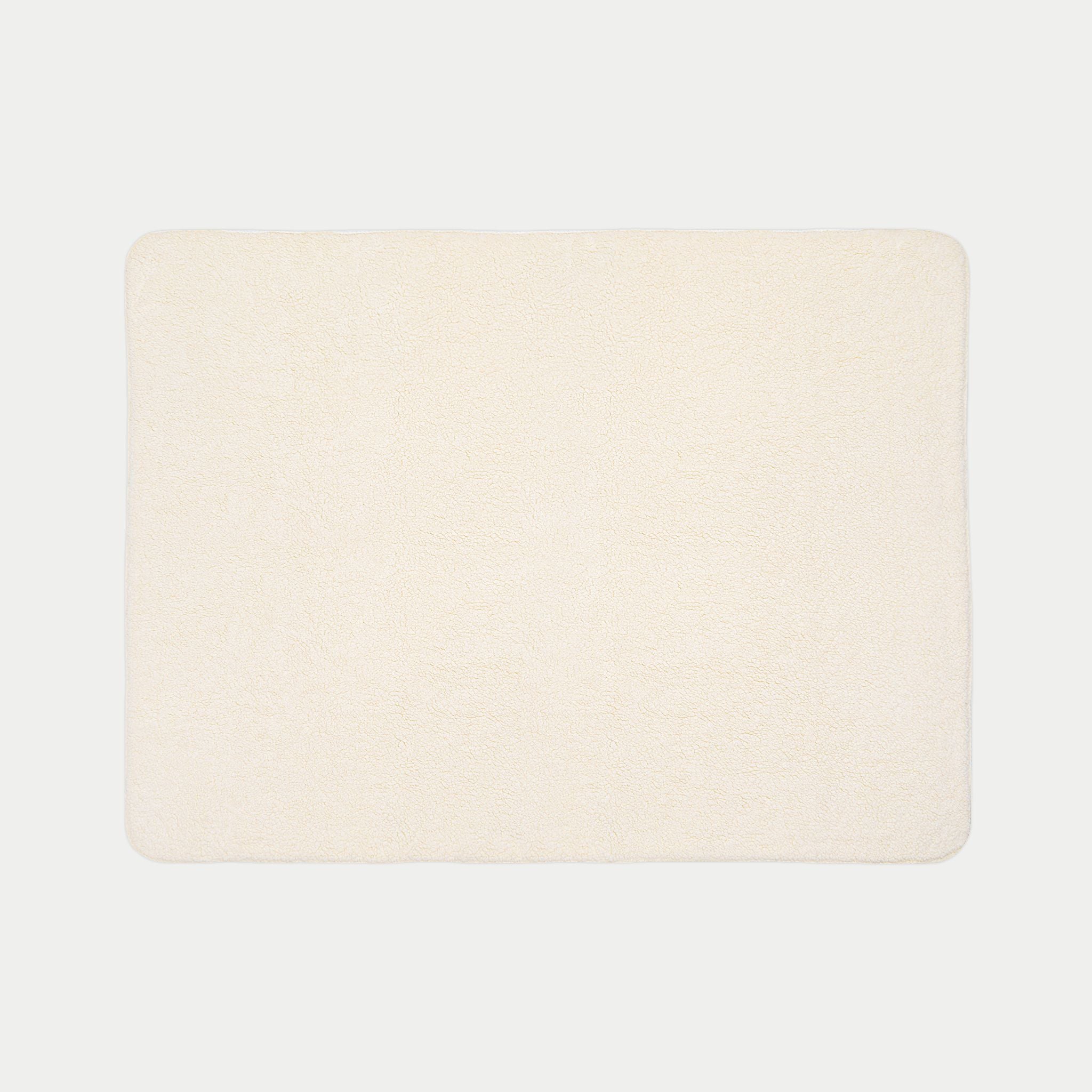 backside of Rectangular blanket with two-tone design on a white background