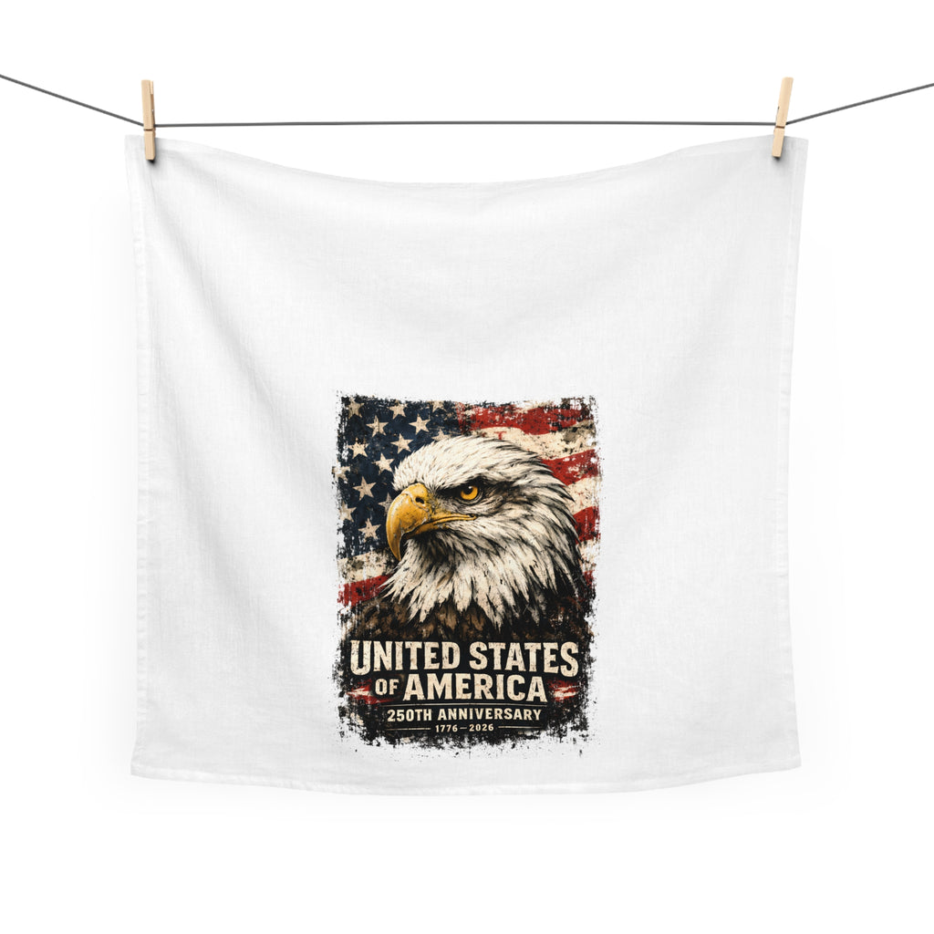 Extra large white tea towel with an eagle and American flag design hanging on a white background