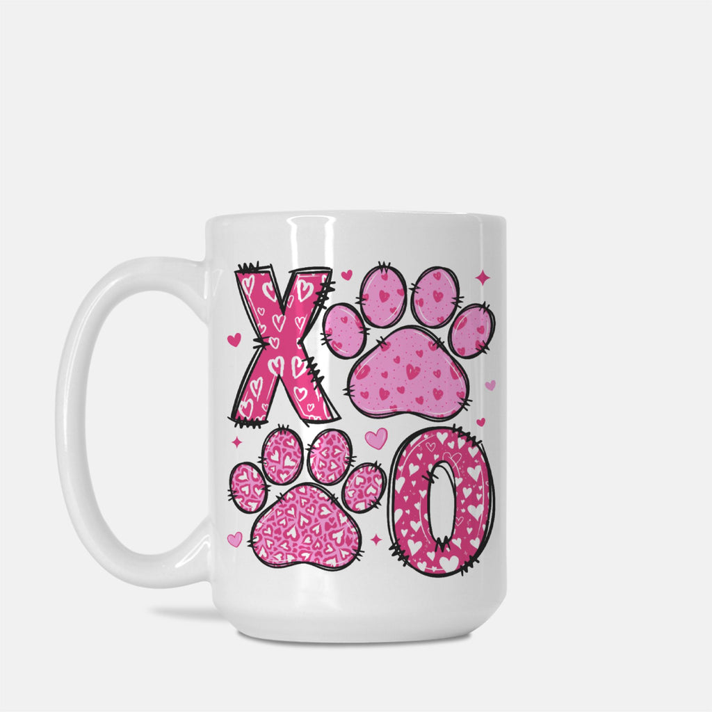 White mug with pink paw prints and 'XO' design on a white background