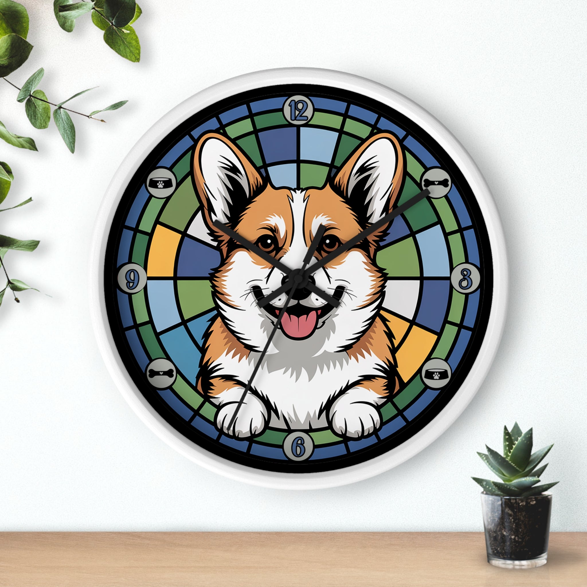 Round white wall clock with a corgi design on a white wall with plants. 