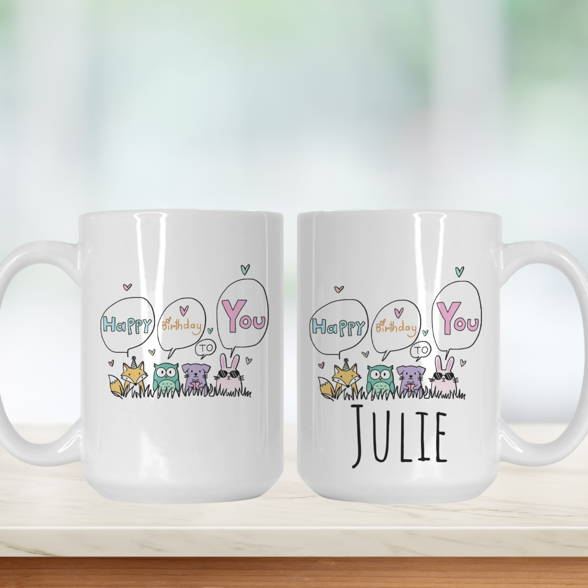 Two white mugs with cartoon designs and text on a light background