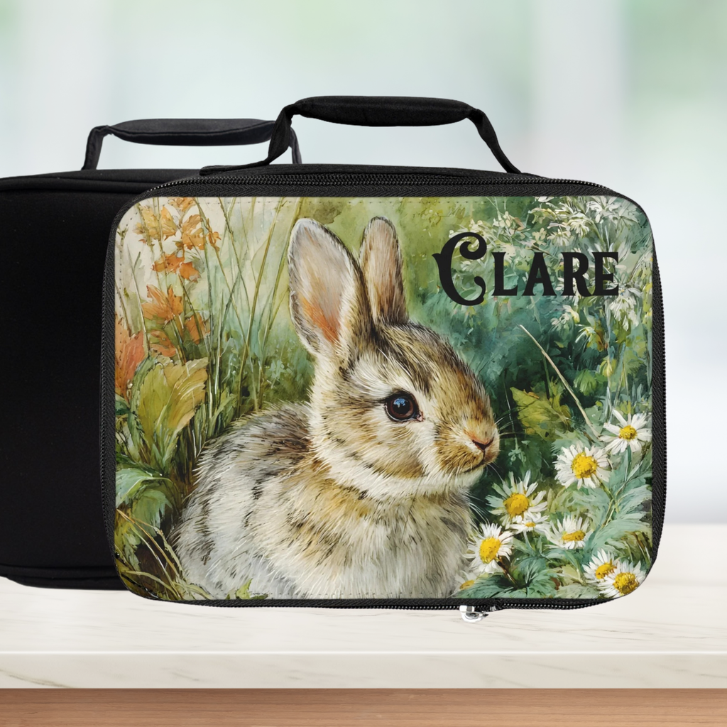Black lunch bag with a rabbit illustration and 'Clare' text on a blurred background