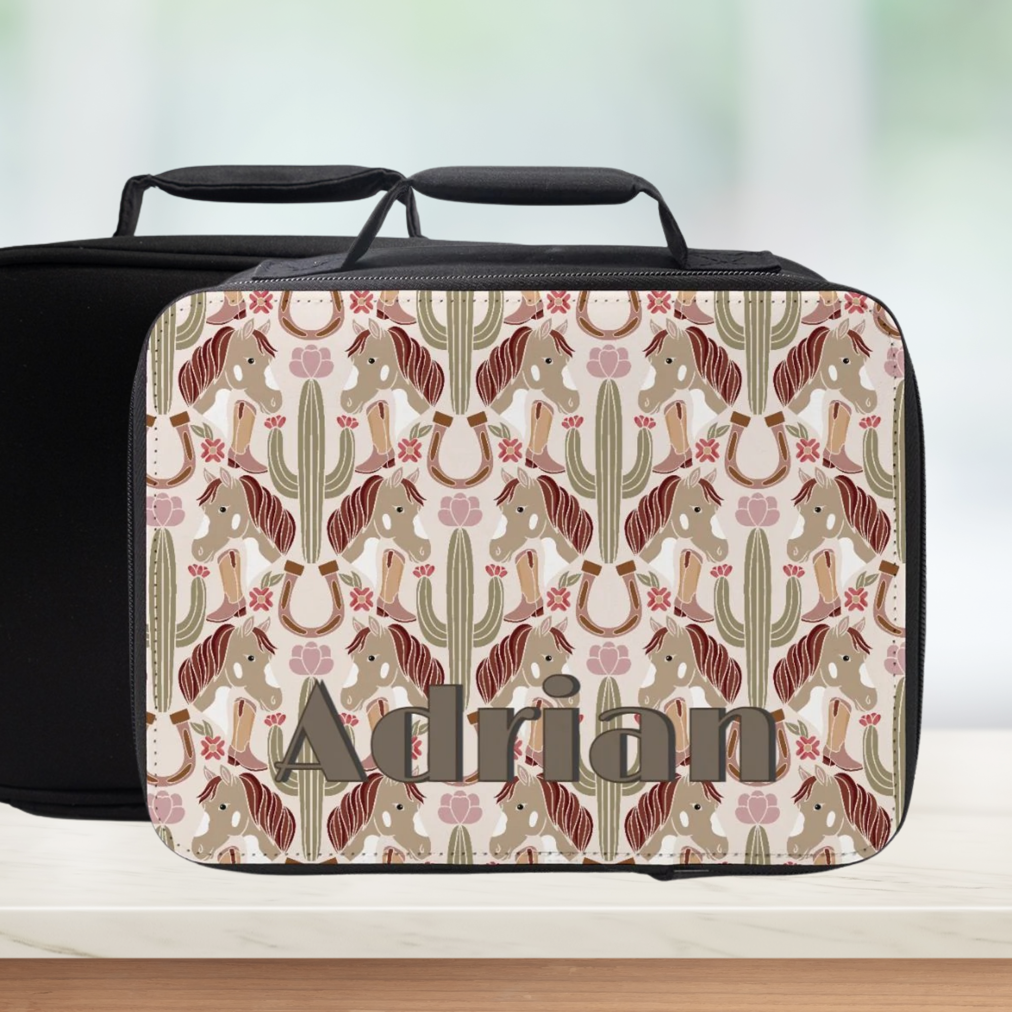 Personalized lunch bag with horse and cactus pattern and 'Adrian' custom text.