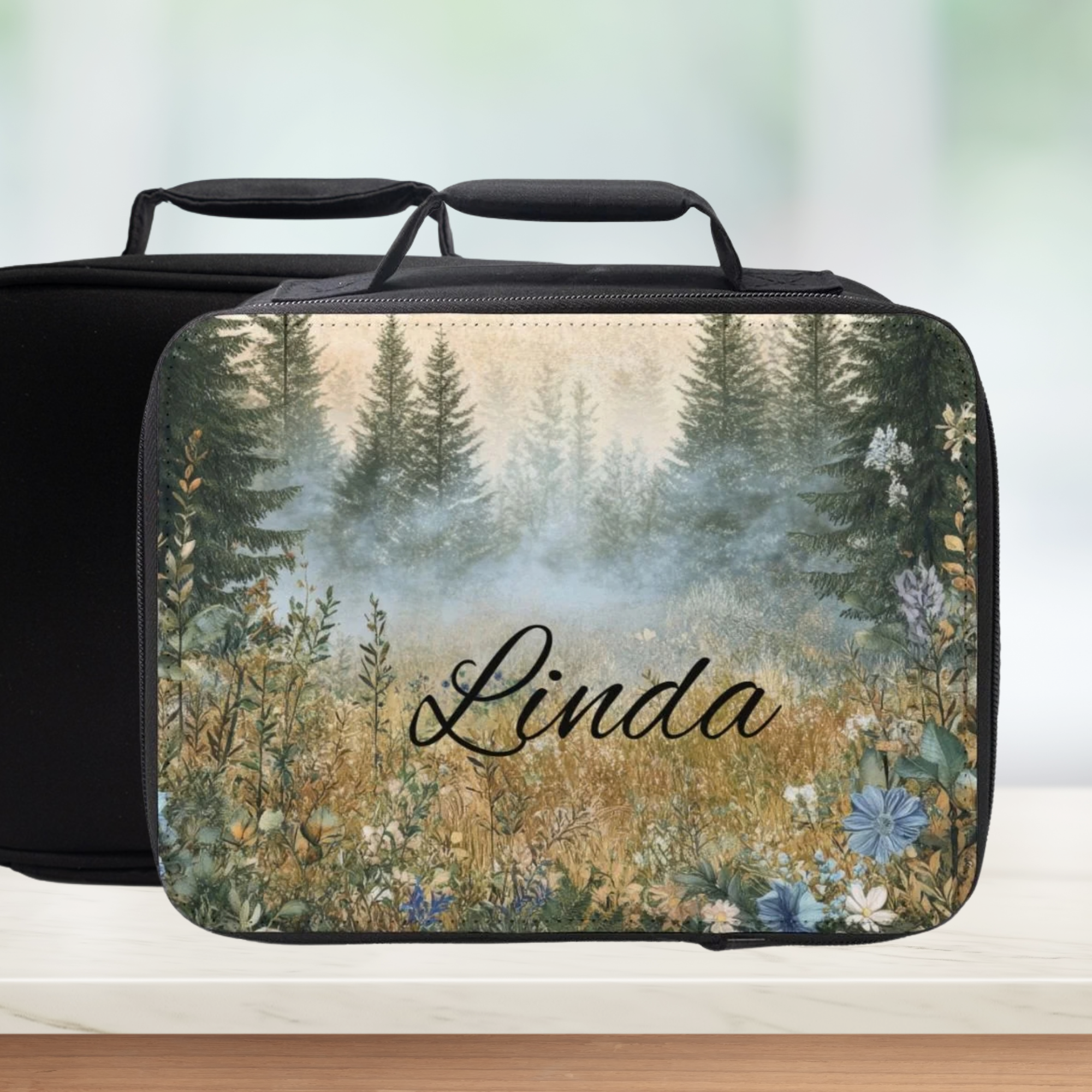 Personalized lunch bag with nature design and 'Linda' text on a blurred background