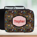 Colorful patterned lunch bag with 'Tayler' on a light background