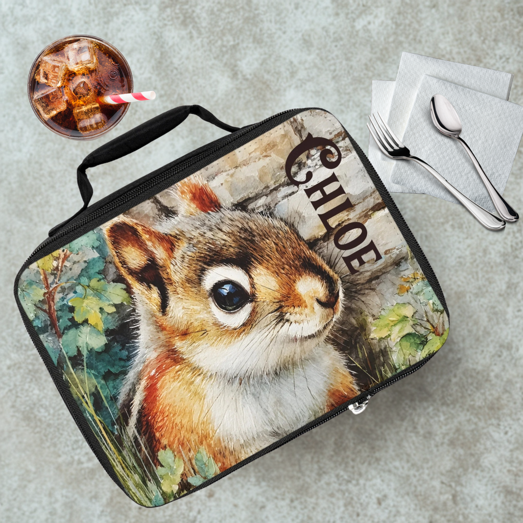 Lunch bag with a chipmunk design on a cafeteria table with a drink and utensils.