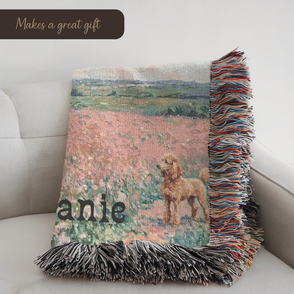 a folded woven blanket on a couch with a golden poodle dog in wildflowers design and personalized text.
