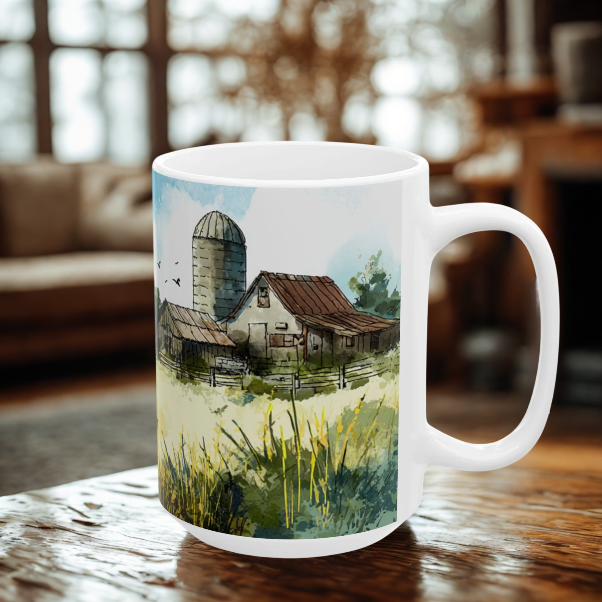 White mug with a scenic design of a barn and silo on a wooden table.
