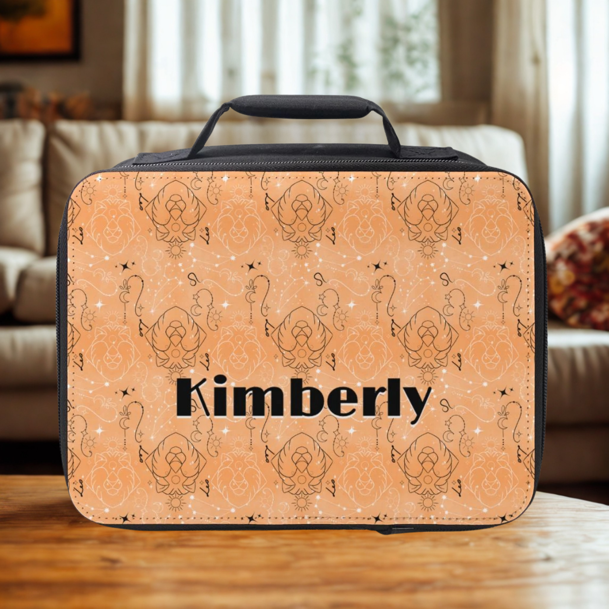 Leo zodiac personalized lunch bag with 'Kimberly' on a wooden coffee table in a cozy living room.