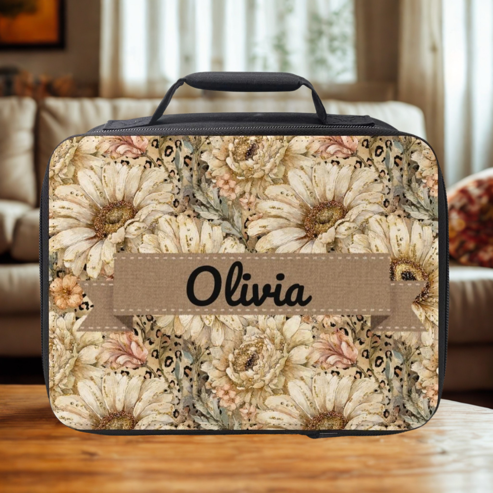 Floral patterned lunch bag with 'Olivia' personalized text on a wooden table in a  cozy living room.